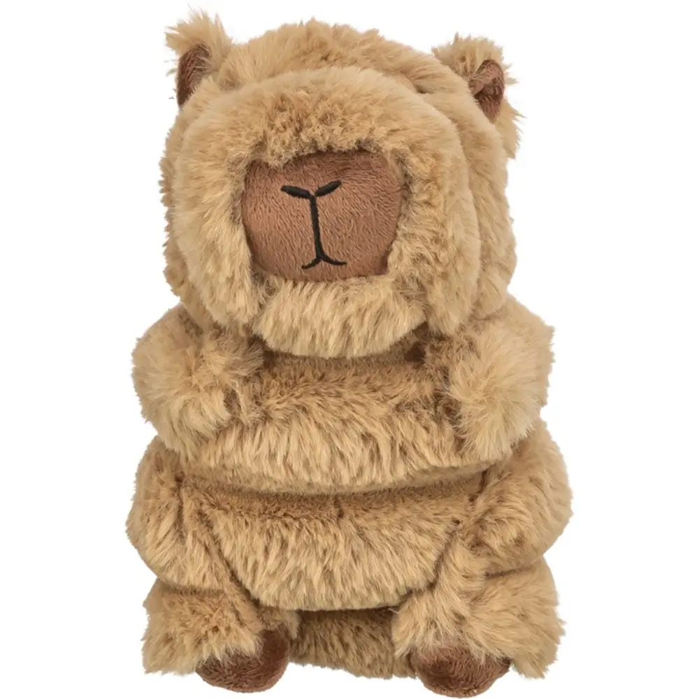Brun kapybara hundleksak i mjuk plysch som sitter upprätt.